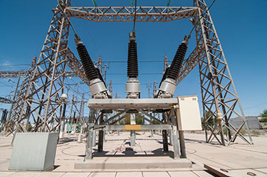 SF6 gas works to absorb the energy of the arc. SF6 gas mitigates the effects of arcing when it captures free electrons. 