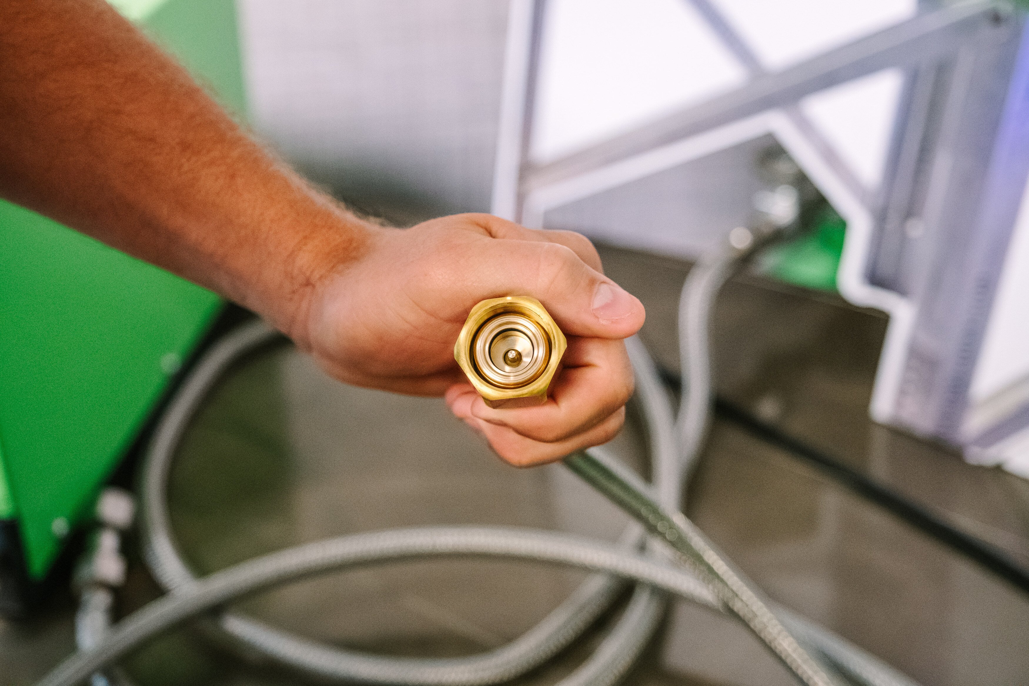 person holding and capping SF6 gas connections